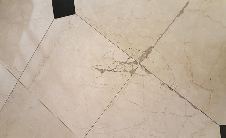 Floor shifting below tile